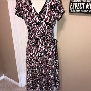 Figure flattering faux wrap knee-length dress great for sizes 6-12
